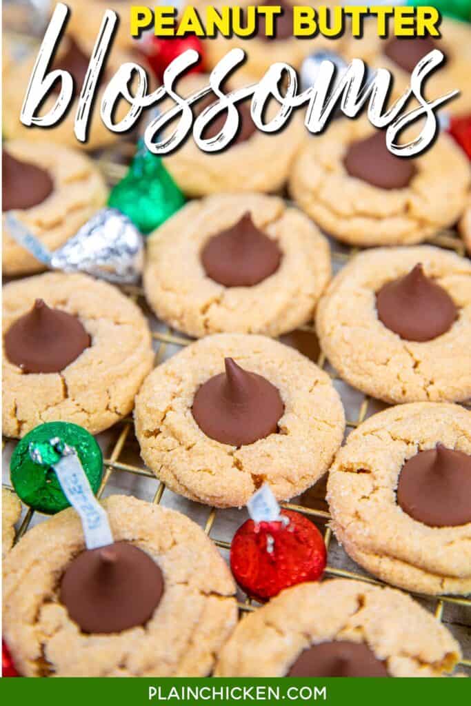 peanut butter cookies topped with a hershey kiss on a cooling rack with text overlay