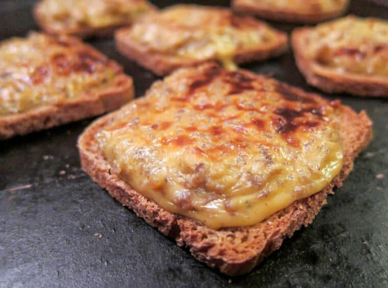 sausage & cheese party rye bread toasts on baking sheet