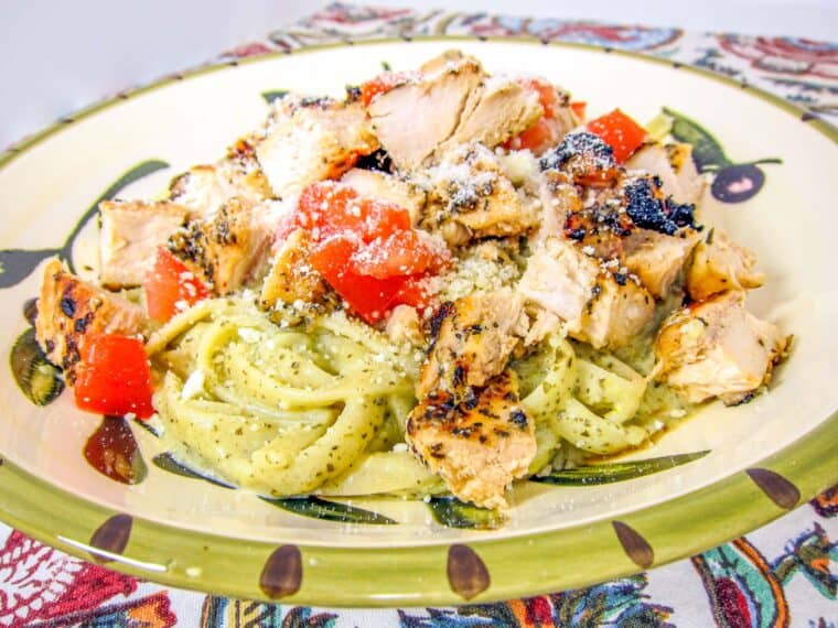 bowl of lemon pest pasta with chicken and tomatoes
