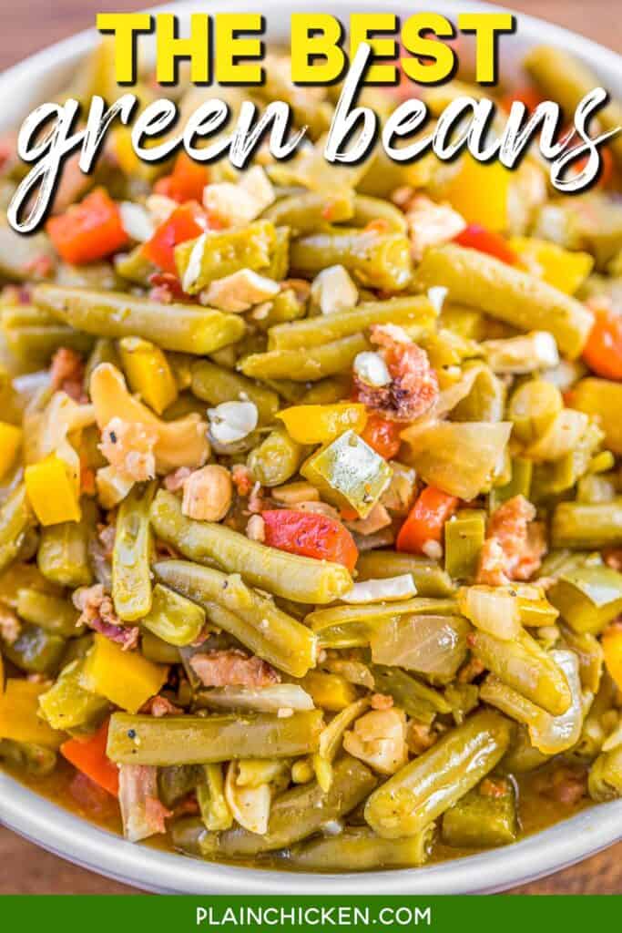 bowl of green beans with peppers onions and bacon with text overlay