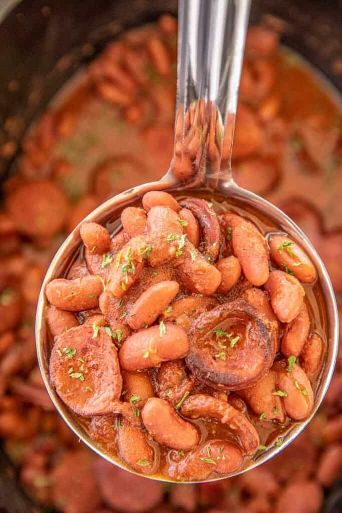 ladle of red beans and smoked sausage