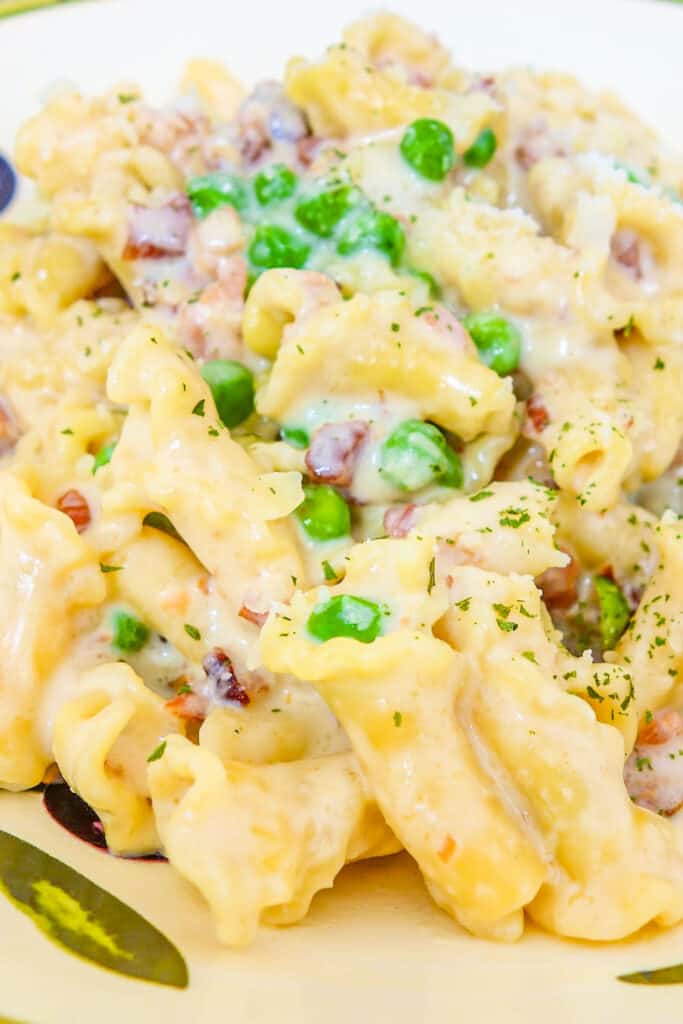 bowl of bacon pasta with peas
