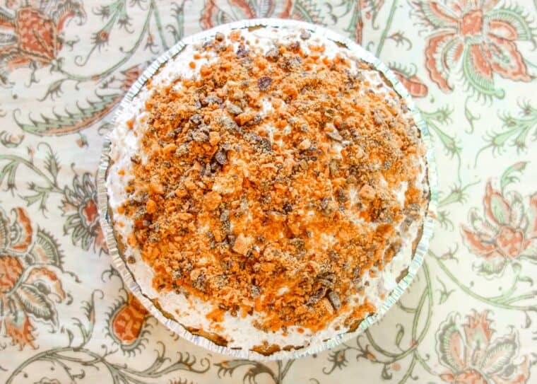 whole butterfinger pie on a table