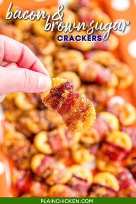 holding a bacon wrapped cracker