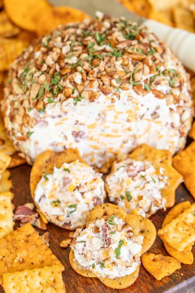 cheese ball on a plate with crackers