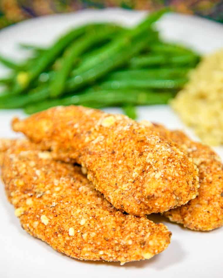 plate of chicken tenders with green beans