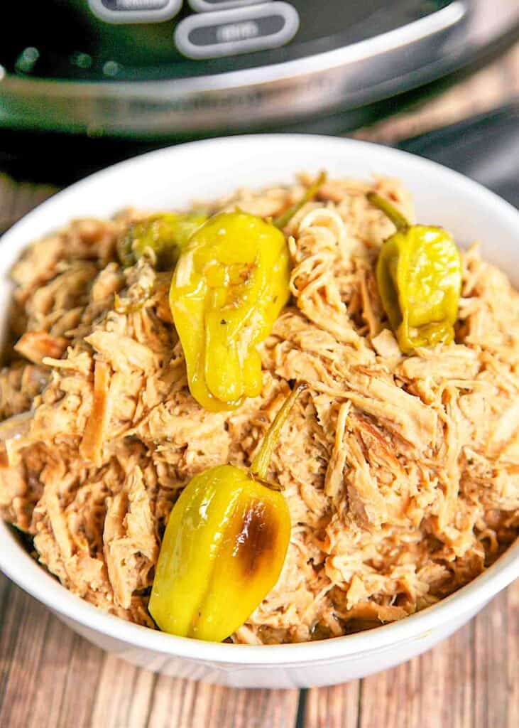 bowl of shredded chicken and banana peppers