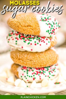 molasses sugar cookies dipped in white chocolate stacked on a plate