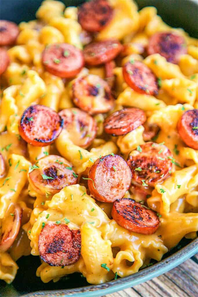 skillet of beer cheese and sausage pasta