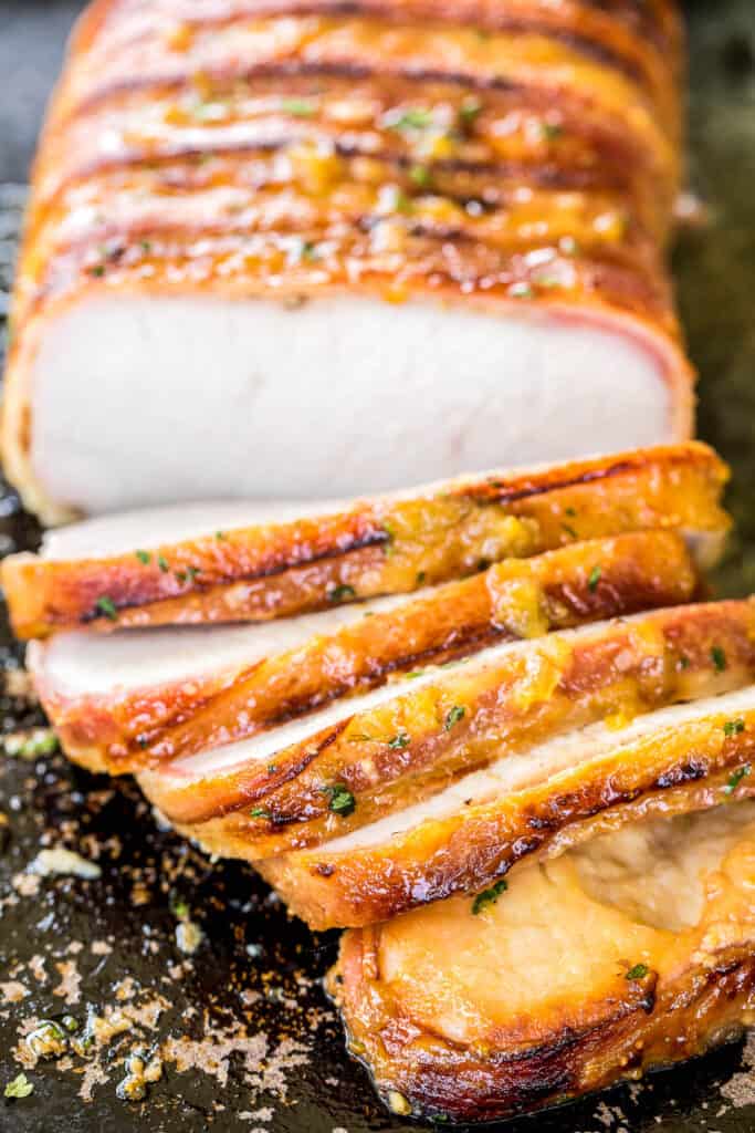 bacon wrapped pork loin on a platter