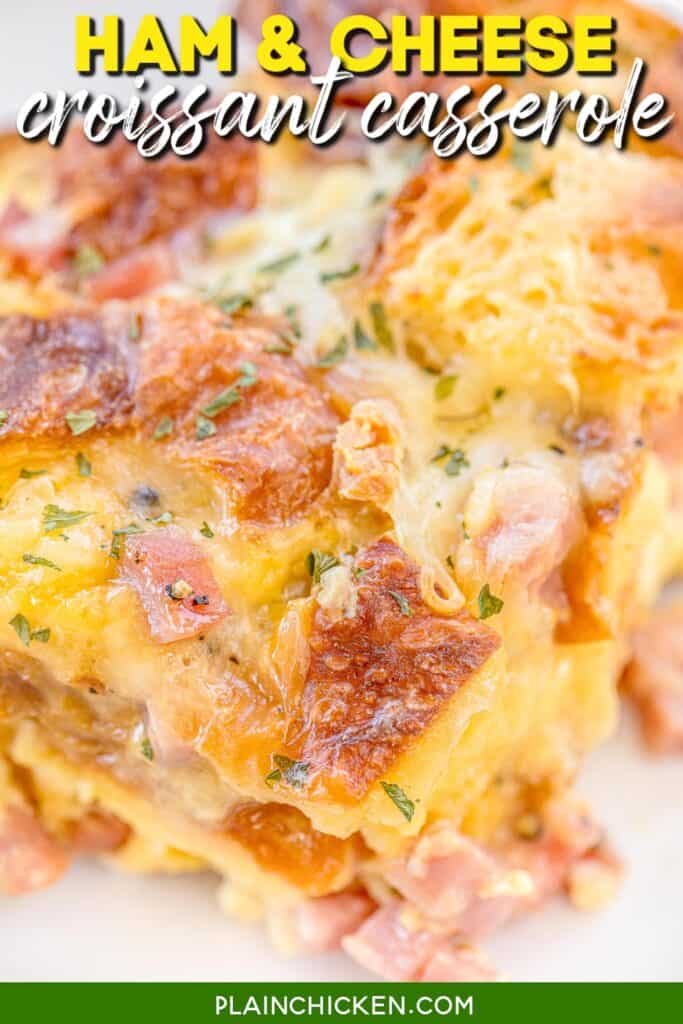 slice of ham and cheese croissant breakfast casserole with text overlay