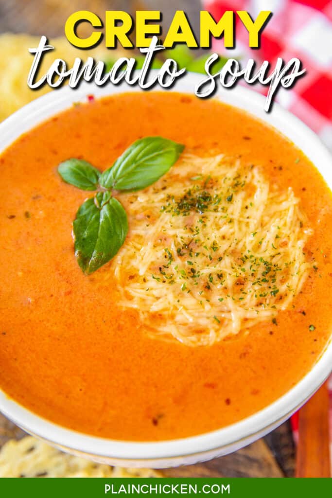 bowl of tomato soup topped with basil and parmesan cheese with text overlay