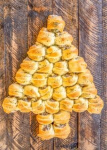 sausage rolls baked in the shape of a christmas tree on a table