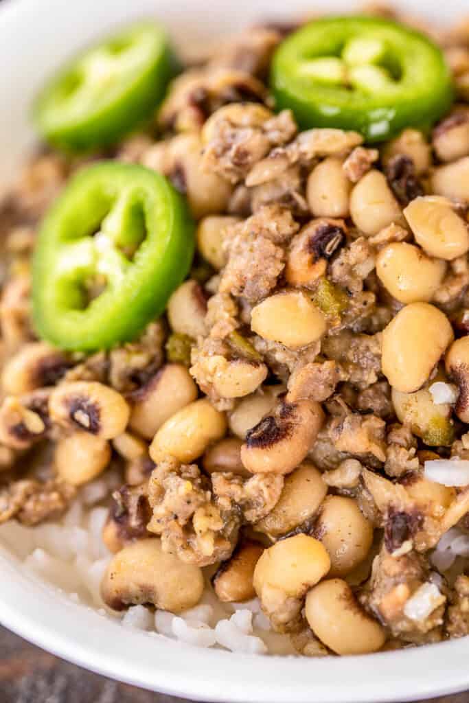 bowl of black-eyed peas with jalapenos and sausage