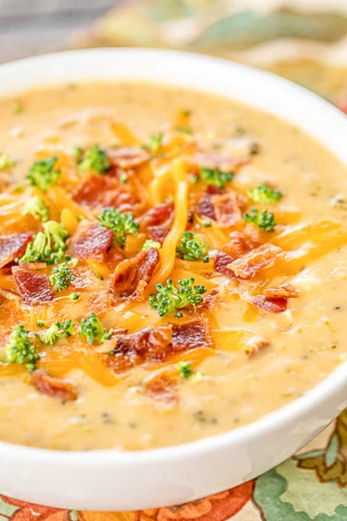 bowl of broccoli soup topped with bacon and cheese