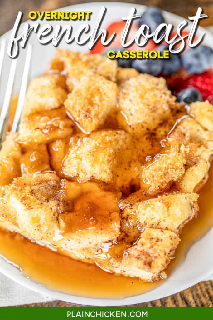 slice of french toast casserole on a plate with fruit