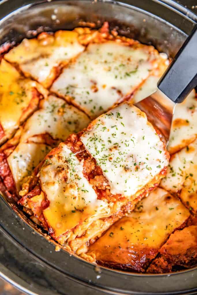 slice of lasagna in a slow cooker