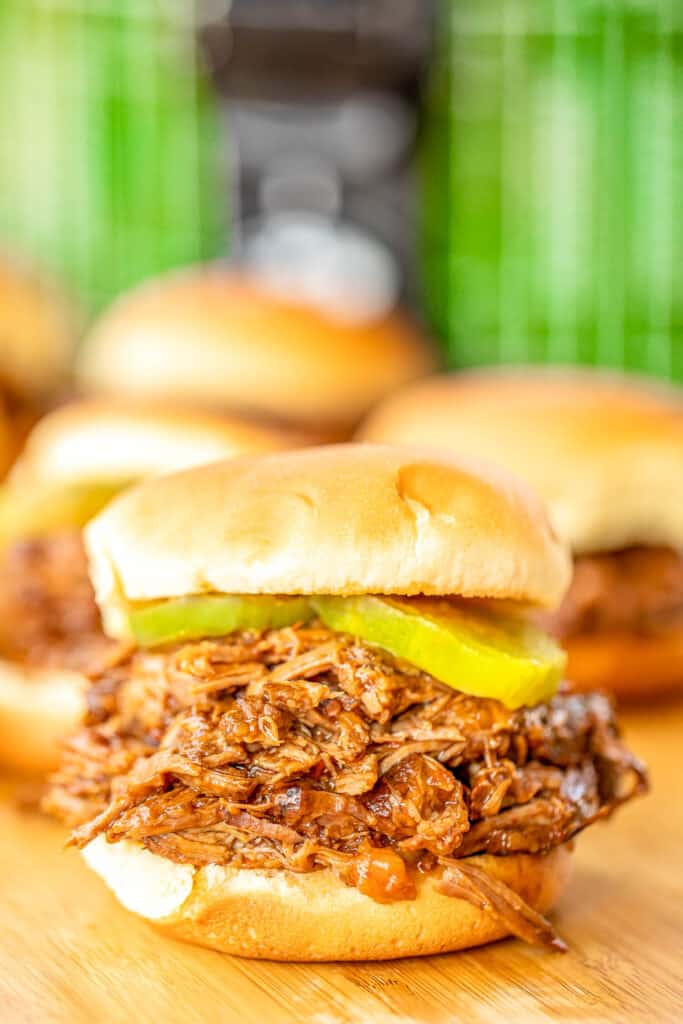 coca-cola pot roast sliders with pickles on a platter