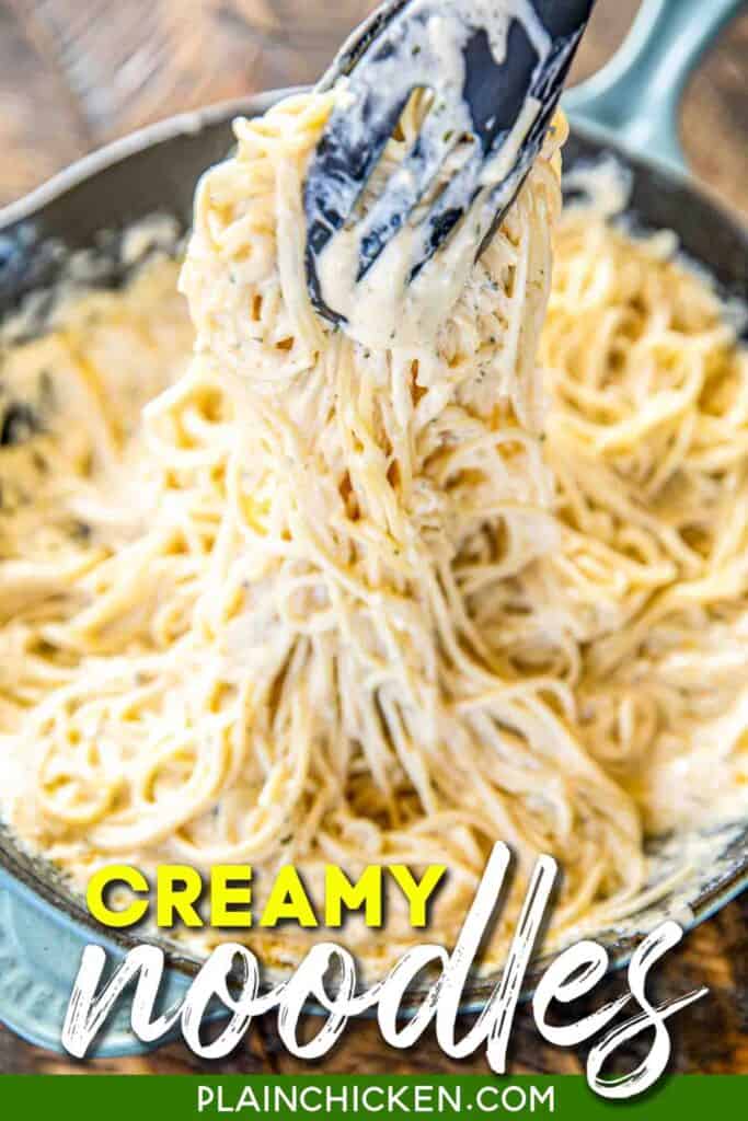 pulling creamy noodles from skillet