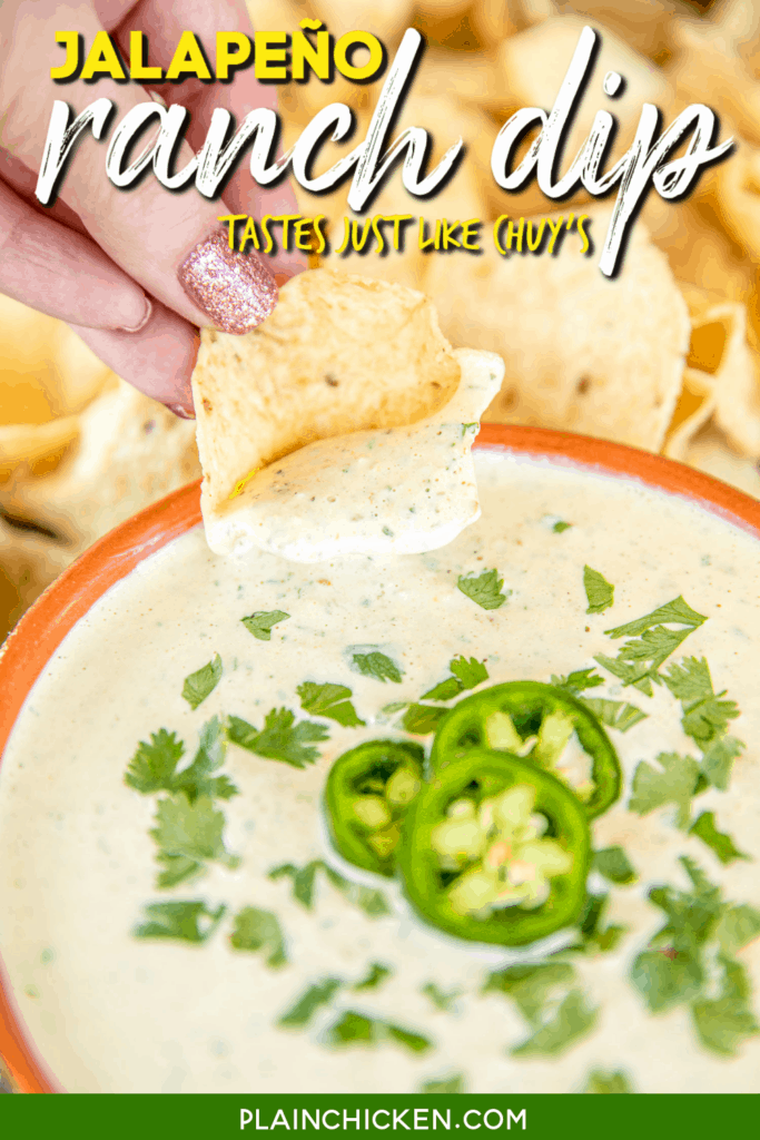dipping a chip into chuy's jalapeno ranch dip