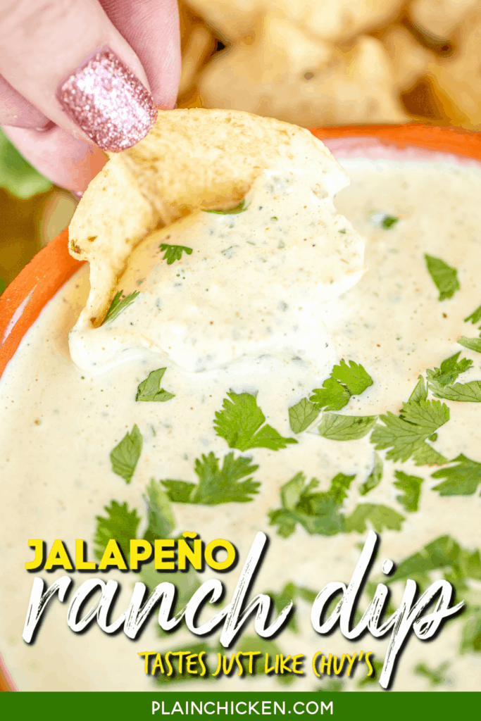 dipping a chip into chuy's jalapeno ranch dip