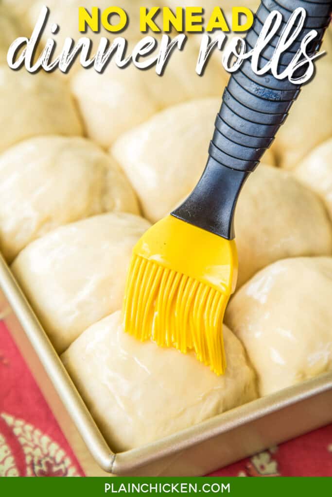 brushing butter on homemade yeast rolls