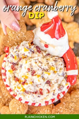 dipping cookie into cream cheese cranberry dip