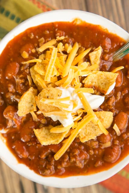 3-Ingredient Chili - ready in 15 minutes! SO easy and everyone loves it! Even picky kids gobble this up! Top chili with your favorite fixings or serve on top of french fries. Seriously delicious. A new family favorite!
