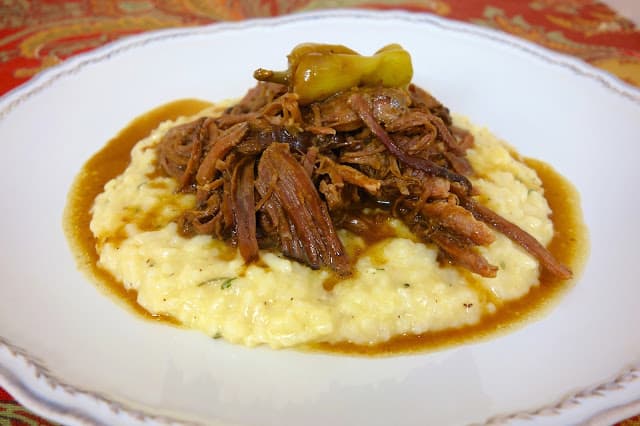 Mississippi Pot Roast - only 5 ingredients!! This is seriously THE BEST post roast I've ever eaten! SO good and SO easy to make! Serve over grits, noodles or potatoes. Everyone raves about this pot roast!