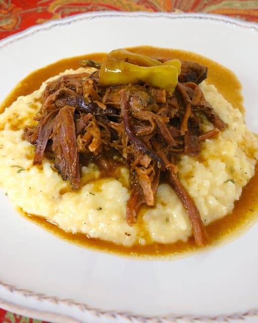 Mississippi Pot Roast - only 5 ingredients!! This is seriously THE BEST post roast I've ever eaten! SO good and SO easy to make! Serve over grits, noodles or potatoes. Everyone raves about this pot roast!