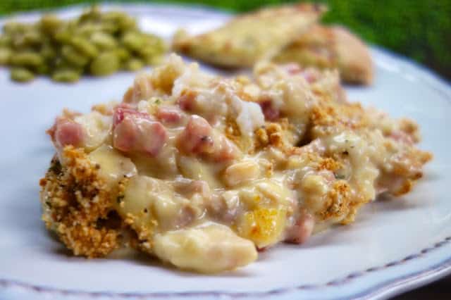 Chicken Cordon Bleu Casserole - seriously delicious!! Packed full of chicken, ham and CHEESE!!! This is super easy to make. Can make it ahead of time and refrigerate or freezer for later. Chicken, ham, swiss cheese, cream of chicken soup, sour cream, milk, dijon mustard, cracker crumbs. Serve with some green beans and rolls. Everyone cleaned their plate! GREAT family friendly casserole! #casserole #chickencasserole #weeknightmeal #familyfriendlymeal