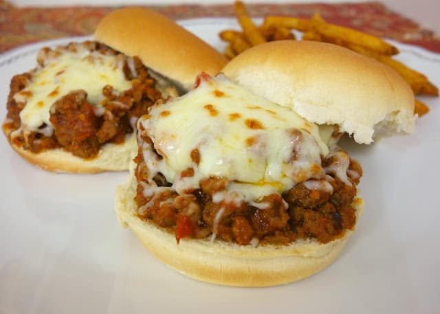 Italian Sloppy Joes recipe - combination of hamburger and sausage simmered in spaghetti sauce - top with mozzarella cheese. My favorite sloppy joe recipes! Ready in 15 minutes!