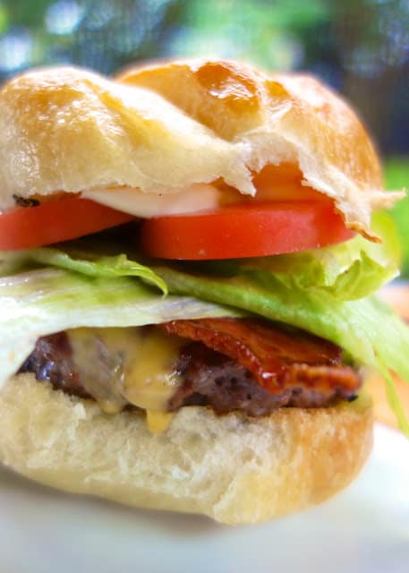 Maple-Bacon Beer Burgers - hamburger, worcestershire, beer and pepper - grilled and topped with homemade maple bacon. SO good! Can make burger patties ahead of time and freezer for later. Our go-to burger!