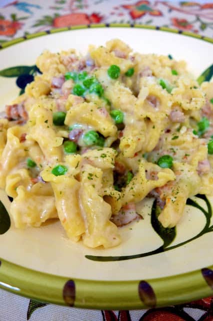 Creamy Bacon Pasta {No Boil} - pasta, chicken broth, evaporated milk, garlic, onion, parmesan, cream cheese,bacon and peas - everything cooks in the same pot, even the pasta! This stuff is SO good and SO easy to make. We ate this two days in a row!