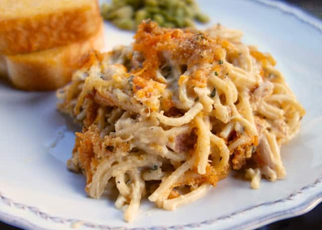 Cheesy Chicken Spaghetti Casserole - chicken, spaghetti, cream of chicken soup, sour cream, butter, seasonings, Parmesan and cheddar cheese -THE BEST! We make this once a month! Makes a great freezer meal! 
