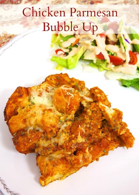 Chicken Parmesan Bubble Up - seriously delicious!! Only 5 ingredients - Chicken, spaghetti sauce, mozzarella cheese, parmesan cheese tossed with cut up refrigerated biscuits! YUM! Ready in 30 minutes! Great weeknight meal!