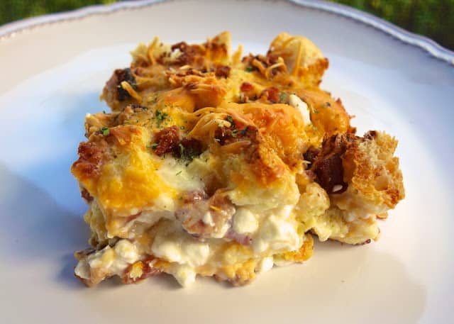 Cheesy Bacon Breakfast Casserole Recipe - bacon, Italian bread, cheddar, mozzarella, cottage cheese, milk, eggs, onion powder, ground mustard and pepper - Can make a head of time and refrigerate overnight. THE BEST breakfast casserole! Great for overnight guests.