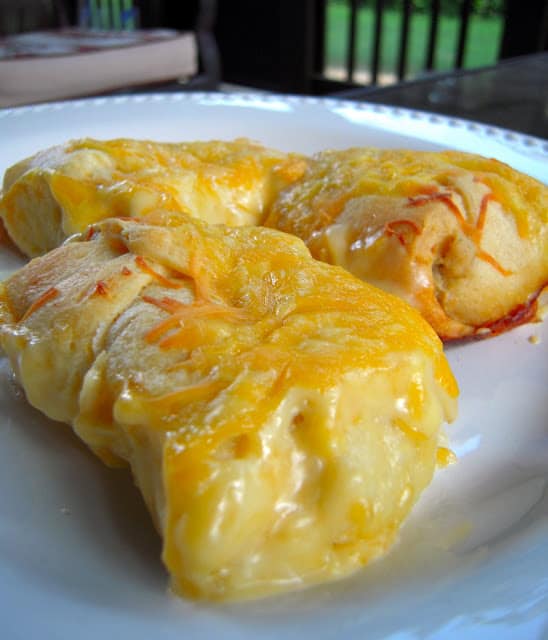 Chicken Rollups #2 - chicken and cream cheese wrapped in crescent rolls and topped cheese - These are on the menu at least once a month! Heaven in a pan! Everyone gobbles these up - we never have any leftovers.