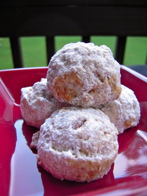 Cinnamon Snowballs - my favorite holiday cookie! Butter, sugar, vanilla, cinnamon, cake flour, corn flakes, pecans and powdered sugar. Makes a lot so these are great for cookie swaps and holiday parties.