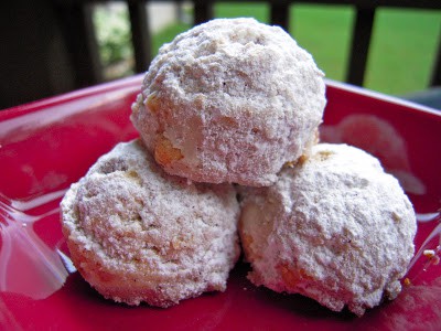 Cinnamon Snowballs - my favorite holiday cookie! Butter, sugar, vanilla, cinnamon, cake flour, corn flakes, pecans and powdered sugar. Makes a lot so these are great for cookie swaps and holiday parties.
