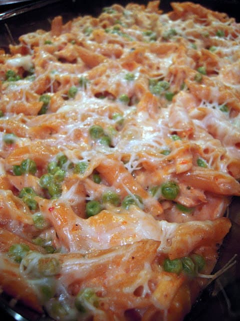 Creamy Chicken Rosa Bake - one of my all-time favorite chicken pasta casseroles! Chicken, cheese, pasta, tomato alfredo and green peas - so simple and SO delicious. Use rotisserie chicken for quick assembly.