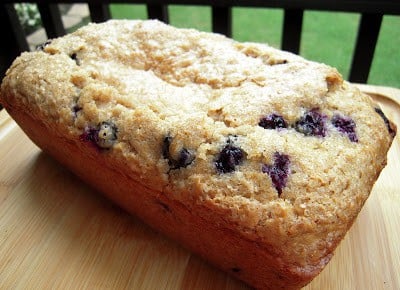Quick Blueberry Bread - AMAZING!!! Quick homemade sweet bread with oatmeal and blueberries. Great for breakfast or dessert! Brown sugar, milk, oil, eggs, flour, oatmeal, baking powder, cinnamon, blueberries and raw sugar. We make this at least once a week! Great toasted with butter or with a big scoop of vanilla ice cream! #bread #blueberries #breakfast