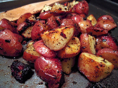 Oven Roasted Greek Potatoes - new potatoes tossed in olive oil, Greek seasoning and lemon. These potatoes are SO good! Only takes a minute to toss together. Everyone raves about them!
