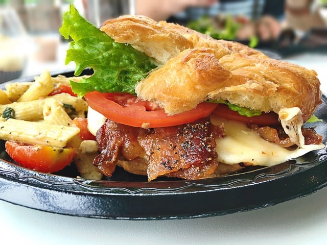 The Grilled Chicken Sandwich at Ashley Macs in Birmingham, AL is my absolute favorite!  Grilled chicken, bacon, Havarti cheese, lettuce, tomato and homemade honey mustard served hot on a toasted croissant.