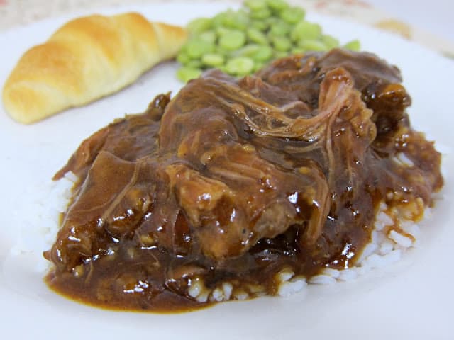 Three Envelope Pot Roast {Slow Cooker} - one of THE BEST pot roast recipes on the internet! Everyone loves this pot roast! Roast, salsa, onion soup, italian dressing and au jus mix. Use leftovers to make sliders. We eat this at least once a month!