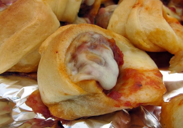 Meatball Sliders - only 4 ingredients! Frozen meatballs, marinara, mozzarella wrapped in crescent rolls. Great for a quick lunch or appetizer!