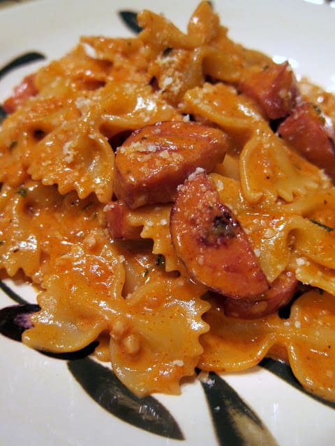 Creamy Jambalaya Pasta - seriously delicious! TONS of great flavor and it is ready in about 15 minutes. Pasta, smoked sausage, heavy cream, garlic, onion, cajun seasoning, paprika, white wine, tomato sauce and parmesan cheese. Better than any restaurant! Everyone RAVES about this easy pasta dish!!!