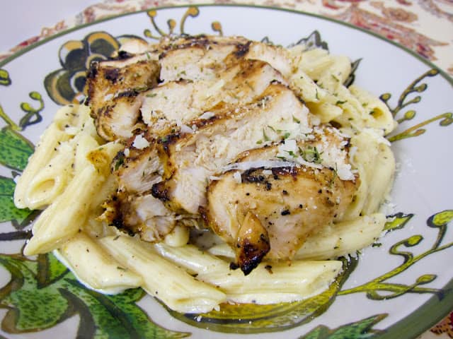 Grilled Cajun Ranch Chicken Pasta - restaurant quality! Chicken marinated in a cajun ranch mixture and grilled, then tossed in a creamy cajun alfredo. I wanted to lick the plate! We made this two days in a row!!