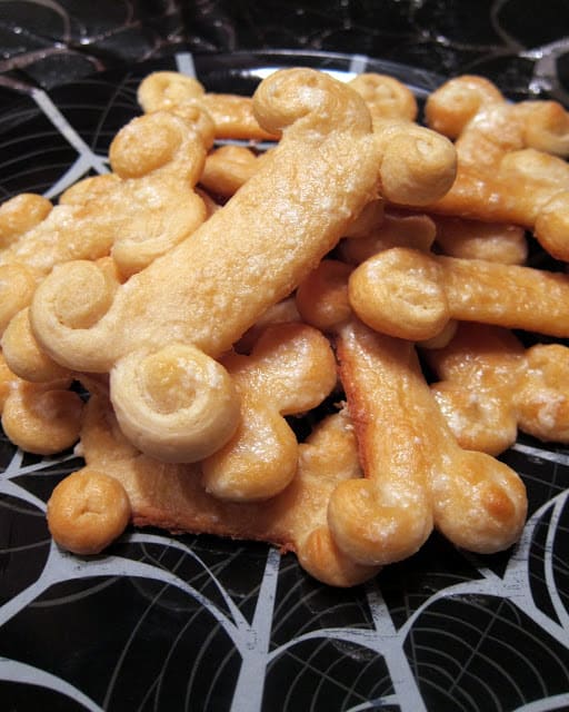 Breadstick Bones - refrigerated bread sticks shaped into bones - great for Halloween - top with garlic butter for a fun side for pasta.