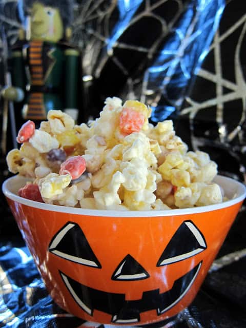 Monster Munch Halloween Mix - popcorn, candy corn, peanuts, Reeses pieces and almond bark - this stuff is crazy good! EVERYONE loves it! It is a great treat for the classroom, neighbors and friends. I have a hard time sharing it! :)
